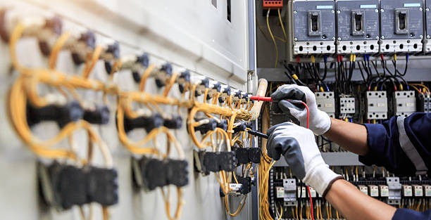 Professional Electrician technician working in Overland Park, KS